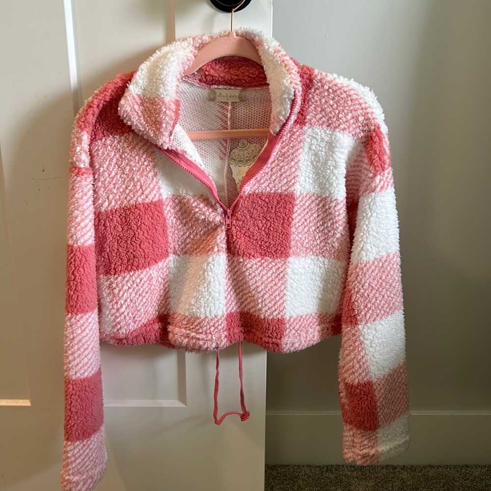 This quarter zip is in a size small and has never been worn before!